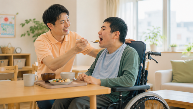 手を取り合うスタッフとご利用者